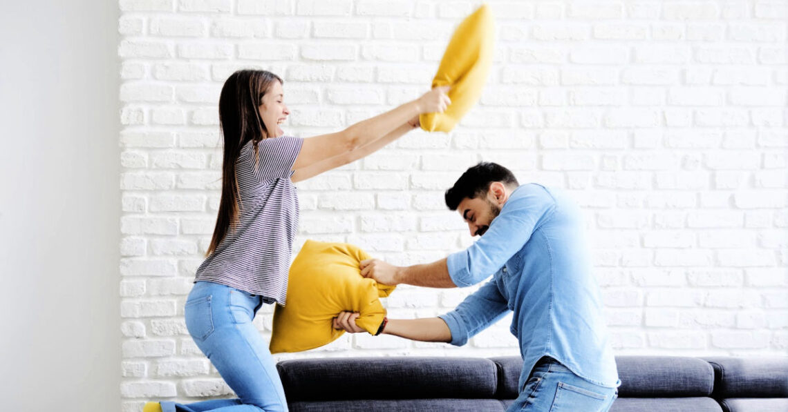 Young Couple having a pillow fight